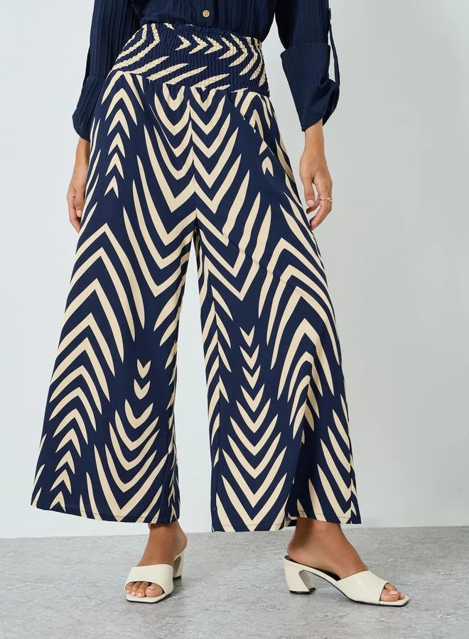 تايك تو بنطال بأرجل واسعة وخصر عالي مرن ومقلم